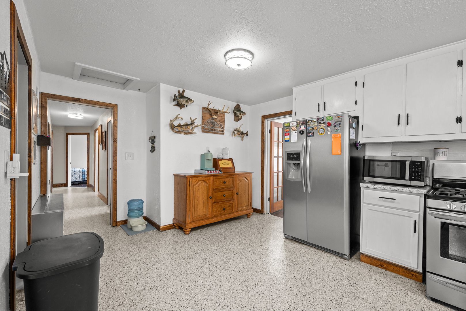 4101 5th Avenue East Moline, IL 61244 - Photo 25 of 36 a kitchen with stainless steel appliances a refrigerator a stove and a sink