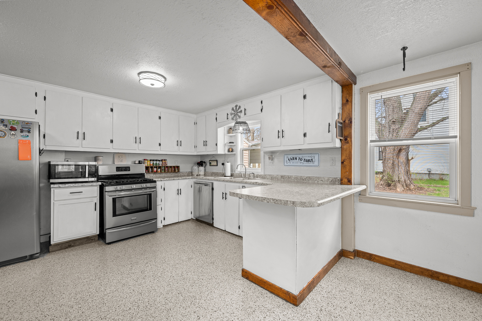 4101 5th Avenue East Moline, IL 61244 - Photo 26 of 36 a kitchen with white cabinets and white appliances