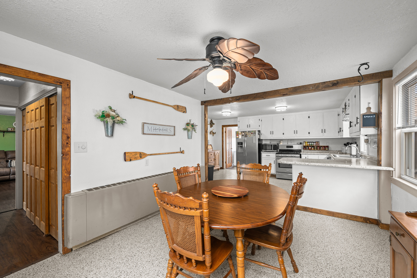 4101 5th Avenue East Moline, IL 61244 - Photo 29 of 36 a dining room with stainless steel appliances kitchen island a table and chairs