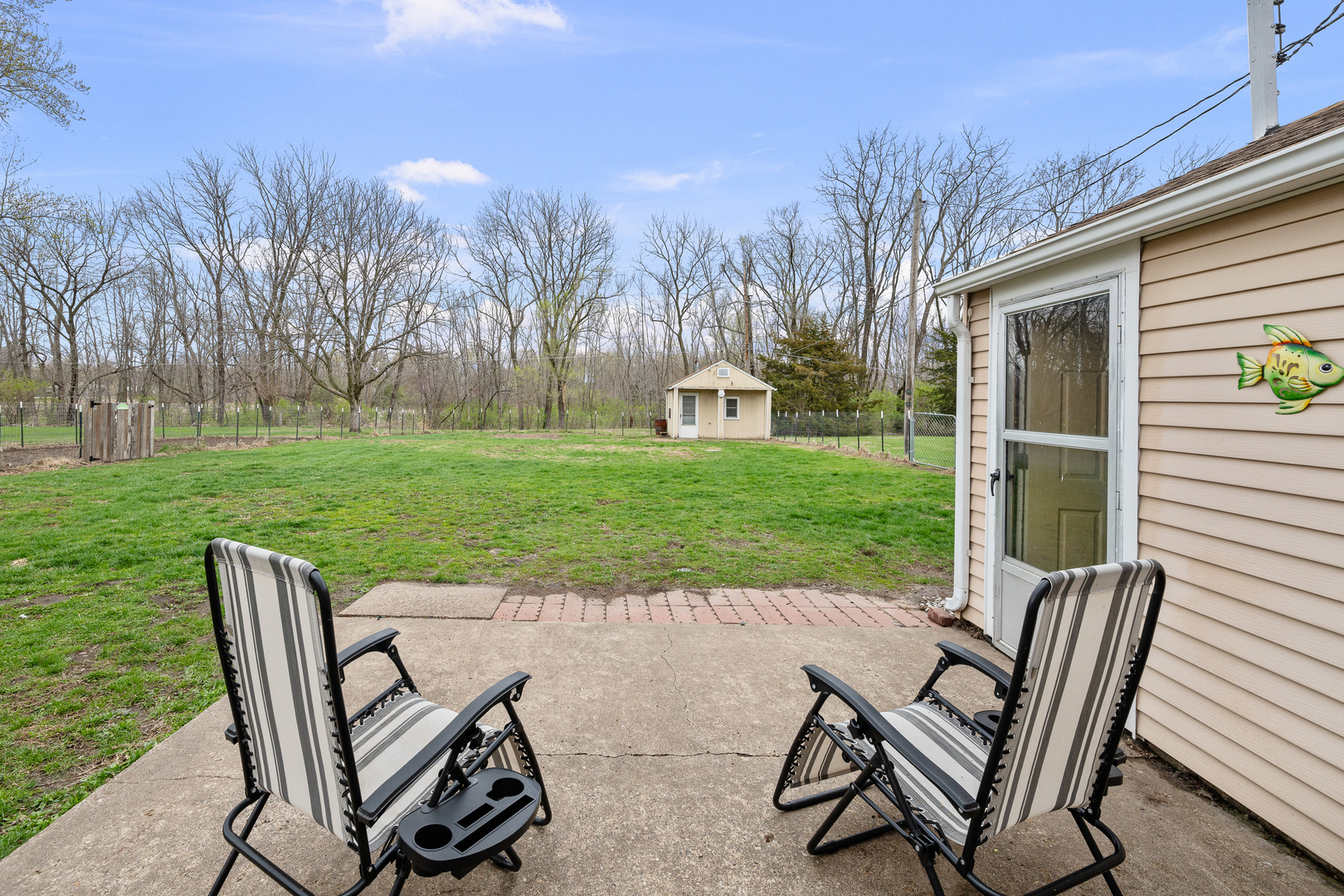 4101 5th Avenue East Moline, IL 61244 - Photo 7 of 36 a view of a two chairs in backyard of house