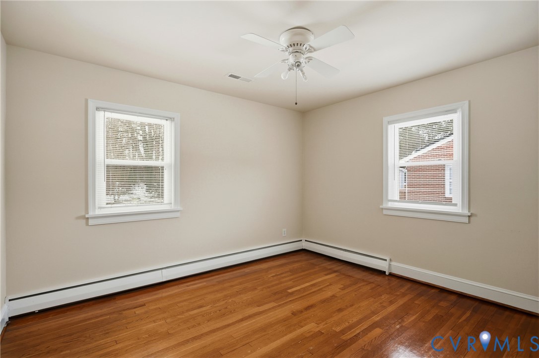 3225 Lakewood Road Glen Allen, VA 23060 - Photo 18 of 43 a view of an empty room with wooden floor and a window