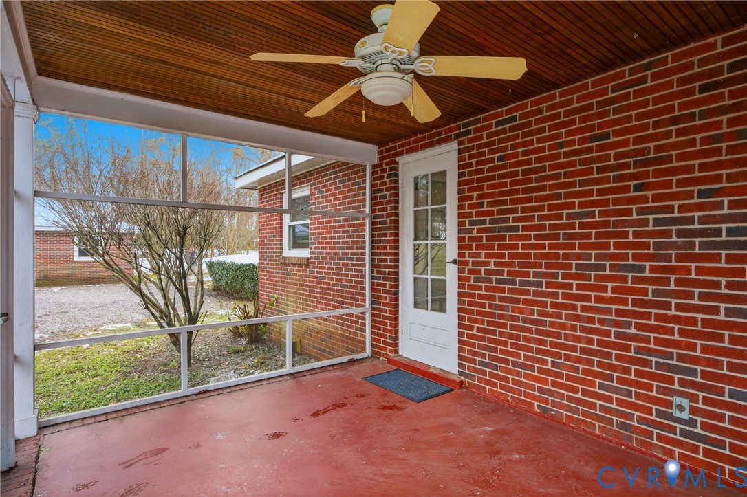 3225 Lakewood Road Glen Allen, VA 23060 - Photo 25 of 43 a view of a porch with a table and chairs