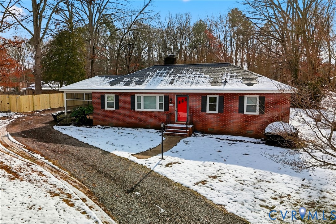 3225 Lakewood Road Glen Allen, VA 23060 - Photo 34 of 43 a view of a house with a yard covered with snow in front of house