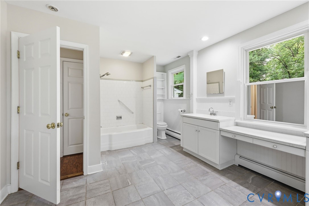 10152 Georgetown Road Mechanicsville, VA 23116 - Photo 20 of 35 a large white bathroom with a tub sink shower and mirror
