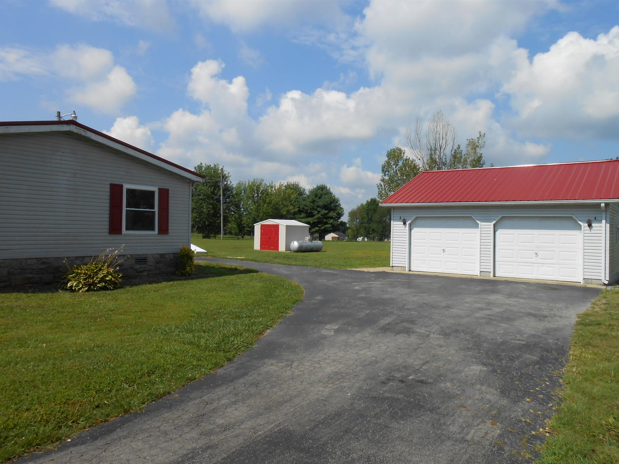 1225 Mt Vernon Road Bethpage, TN 37022 - Photo 3 of 15 a front view of a house with a yard and garage