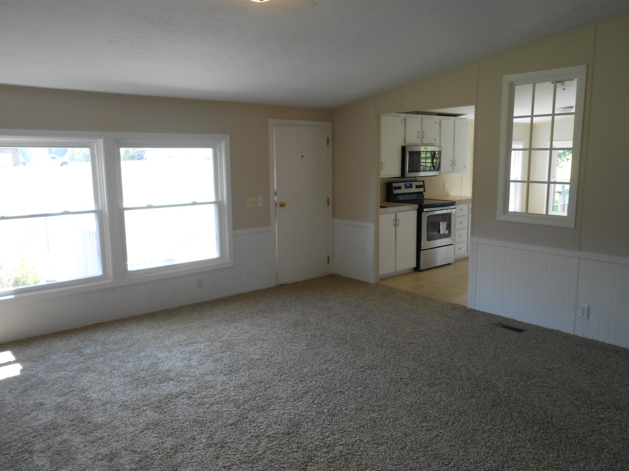 1225 Mt Vernon Road Bethpage, TN 37022 - Photo 7 of 15 an empty room with windows and fireplace