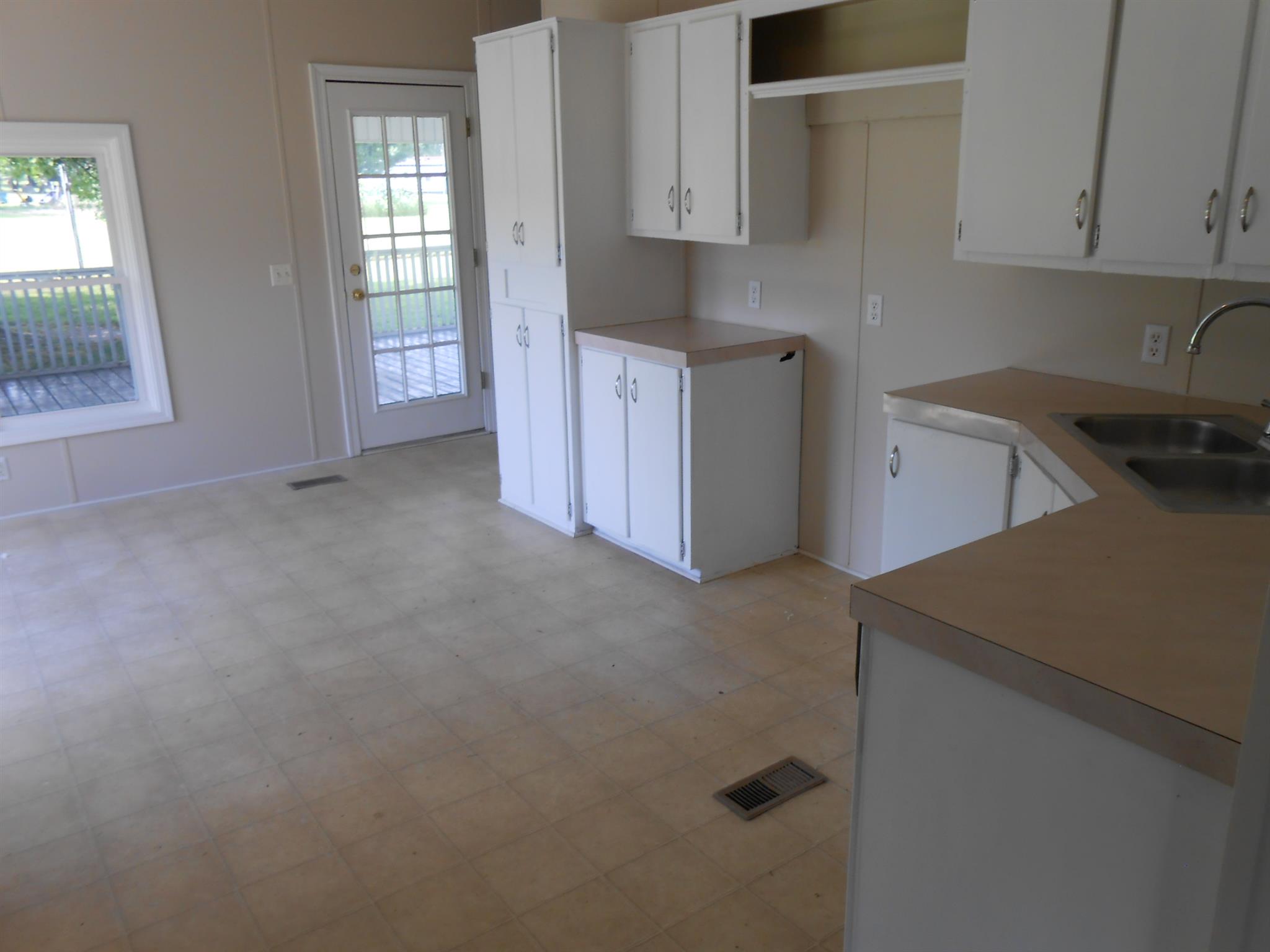 1225 Mt Vernon Road Bethpage, TN 37022 - Photo 8 of 15 a kitchen with cabinets and window