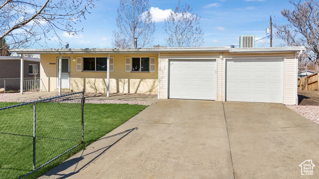 10332 South Zinnia Way Sandy, UT 84094 - Photo 1 of 1 Ranch-style home with a front lawn and a garage