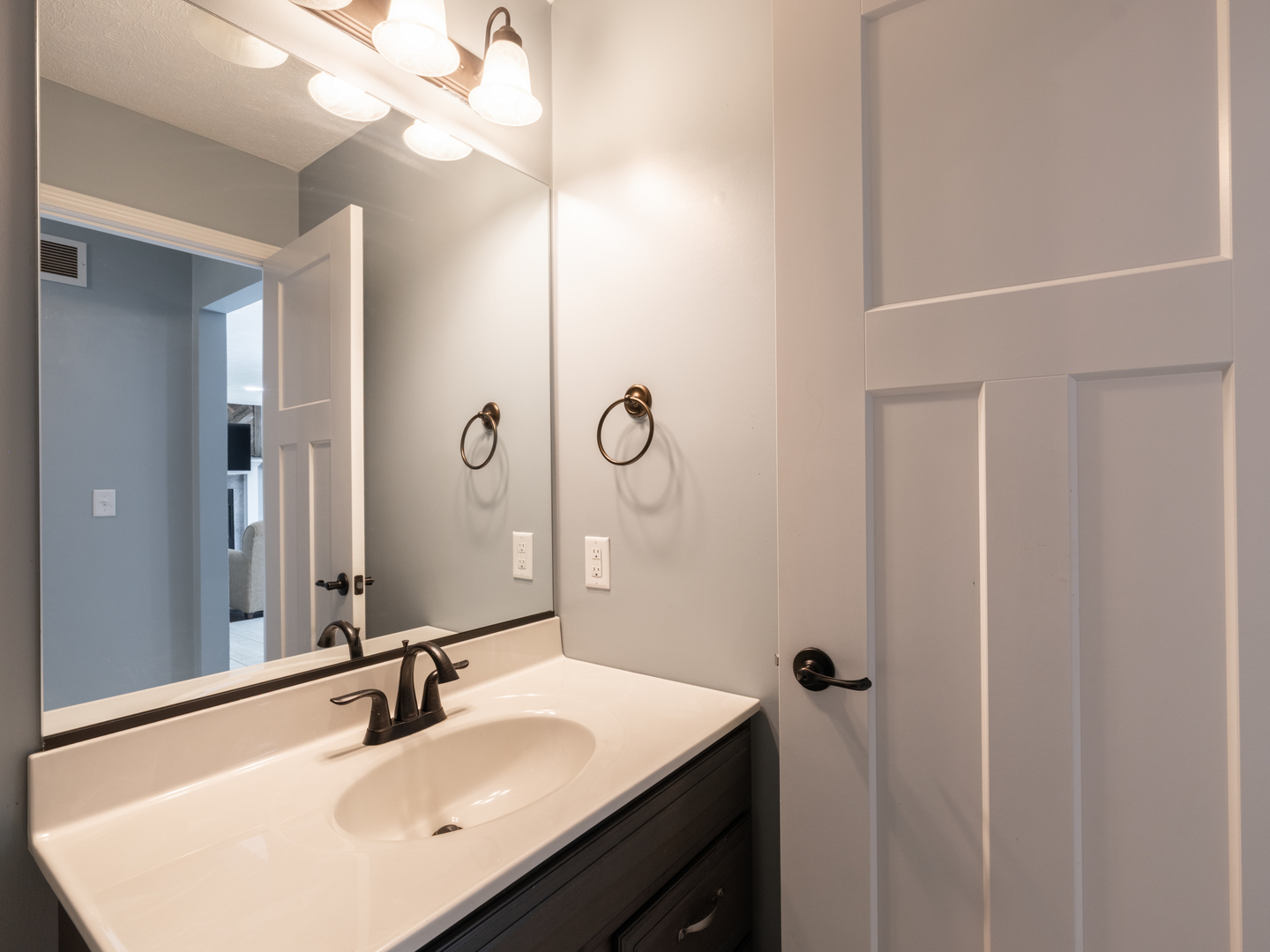 25 Greenbriar Road Mackinaw, IL 61755 - Photo 18 of 51 a bathroom with a sink vanity granite and a mirror