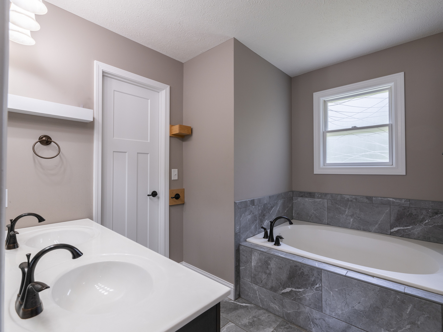 25 Greenbriar Road Mackinaw, IL 61755 - Photo 30 of 51 a bathroom with a sink and a bathtub