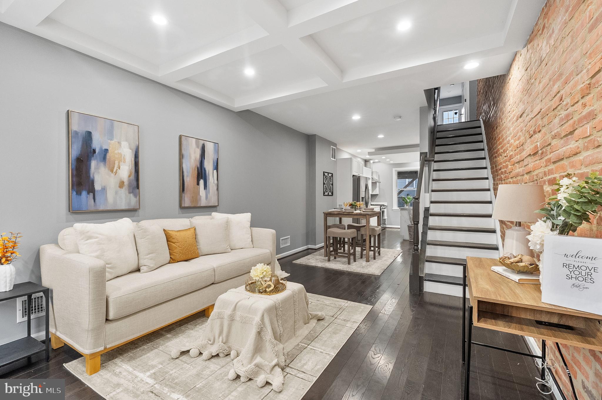 632 South Macon Street Baltimore, MD 21224 - Photo 2 of 20 a living room with furniture and wooden floor