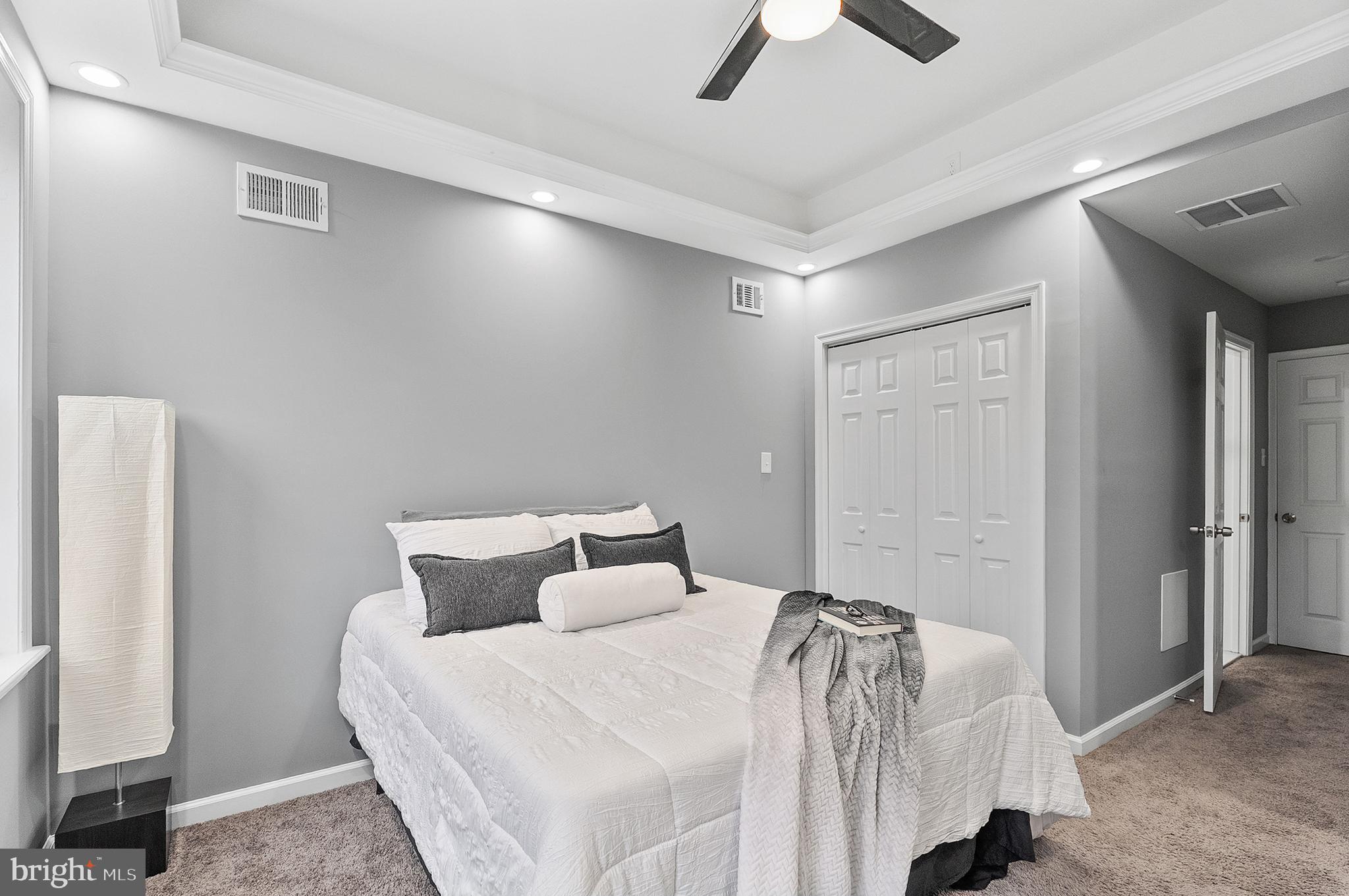 632 South Macon Street Baltimore, MD 21224 - Photo 6 of 20 a bedroom with a bed and a ceiling fan