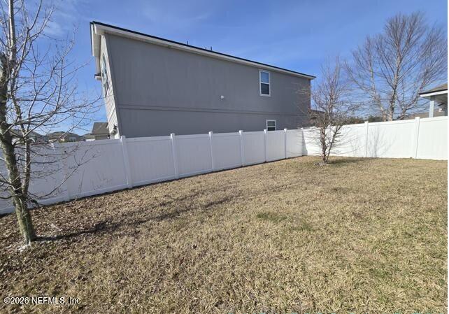 8182 Dancing Fox Street Jacksonville, FL 32222 - Photo 3 of 11 a view of backyard with wooden fence