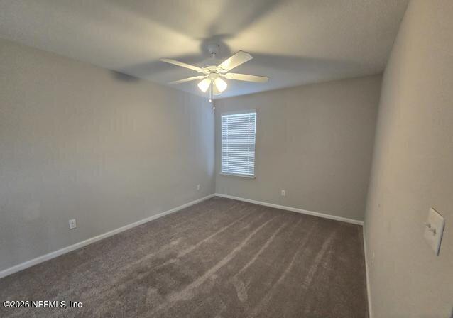 8182 Dancing Fox Street Jacksonville, FL 32222 - Photo 6 of 11 a view of an empty room with a window