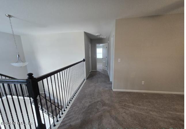 8182 Dancing Fox Street Jacksonville, FL 32222 - Photo 7 of 11 a view of a hallway with wooden floor and entryway