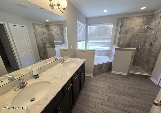 8182 Dancing Fox Street Jacksonville, FL 32222 - Photo 9 of 11 a bathroom with a double vanity sink a mirror and a shower