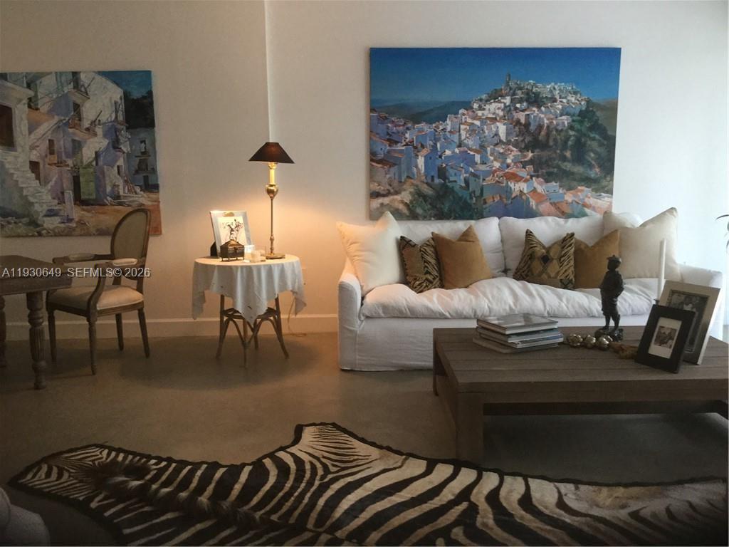 199 Ocean Ln Drive, Unit 102 Key Biscayne, FL 33149 - Photo 14 of 26 a living room with furniture and a fireplace