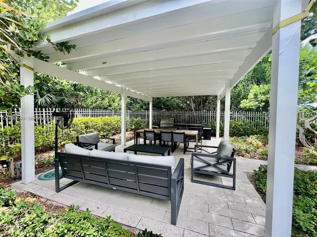 a outdoor living space with furniture and garden view