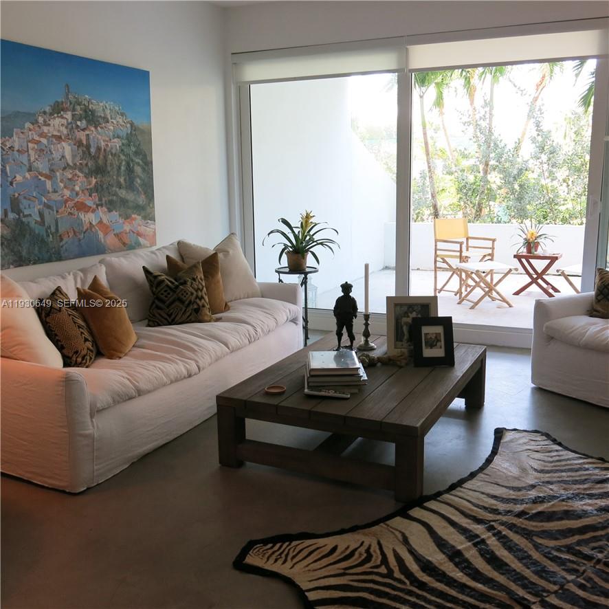 199 Ocean Ln Drive, Unit 102 Key Biscayne, FL 33149 - Photo 8 of 24 a living room with furniture and a large window