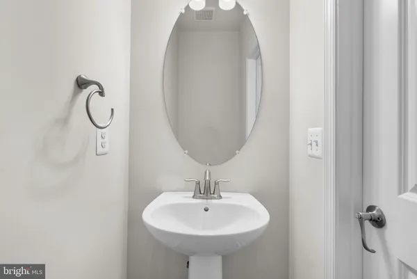 a bathroom with a sink a mirror and a shower
