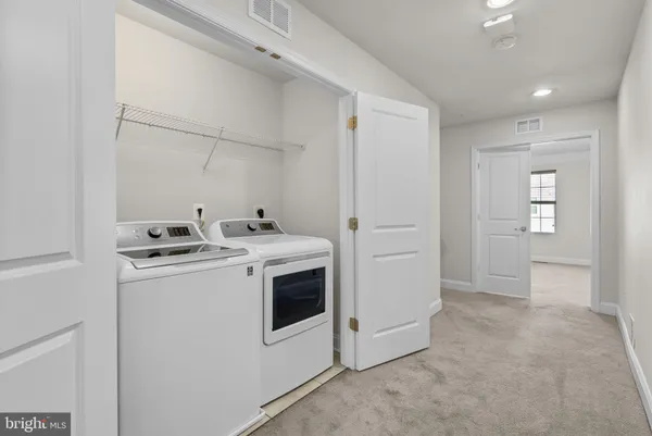 a view of utility room with washer and dryer