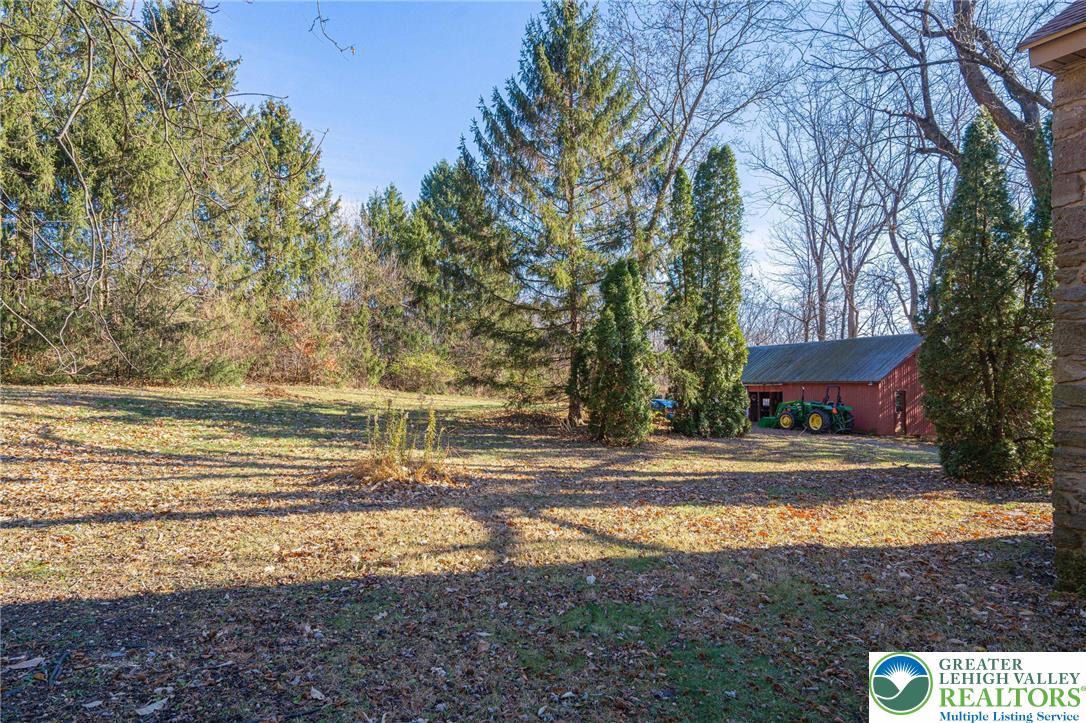 621 Nursery Road Kempton, PA 19529 - Photo 49 of 64 a view of a house with a yard