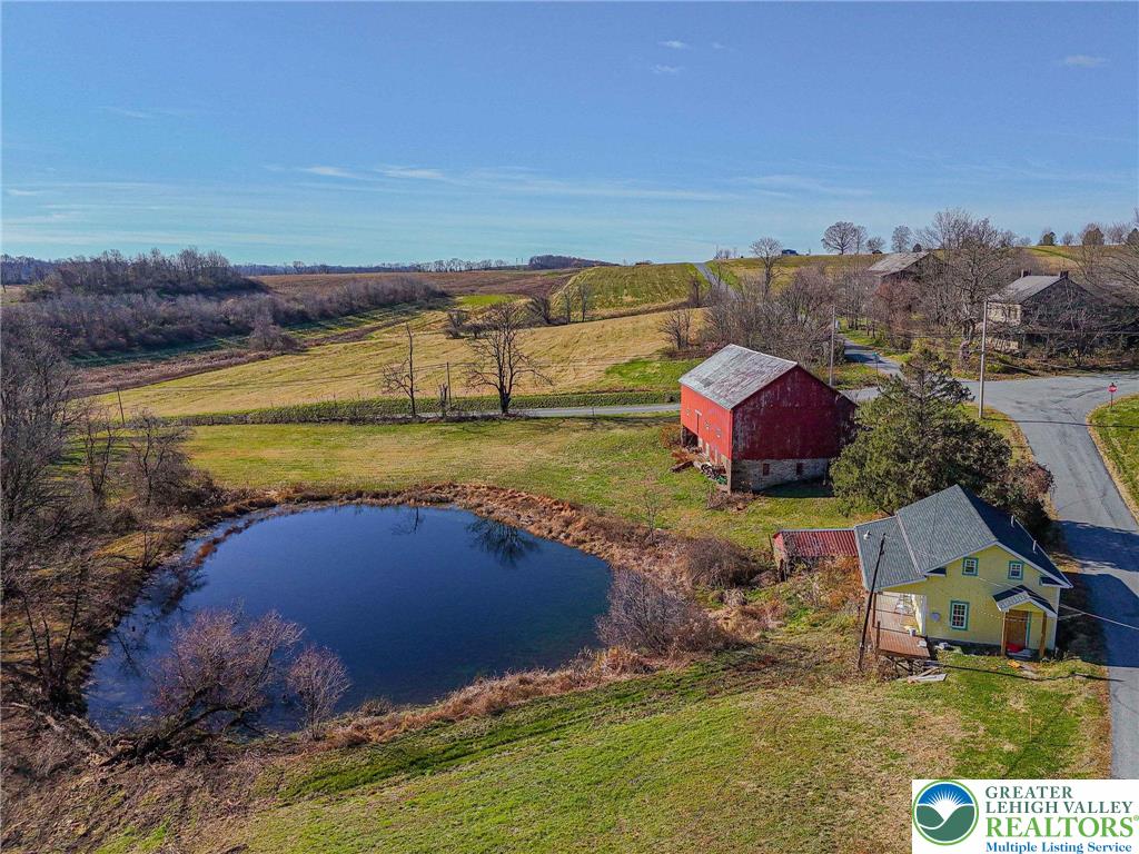 621 Nursery Road Kempton, PA 19529 - Photo 56 of 64 an aerial view of a house with a yard swimming pool and outdoor seating