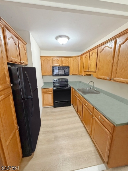 680 Highway 15 Lake Hopatcong, NJ 07849 - Photo 4 of 6 a kitchen with stainless steel appliances granite countertop a refrigerator and a sink