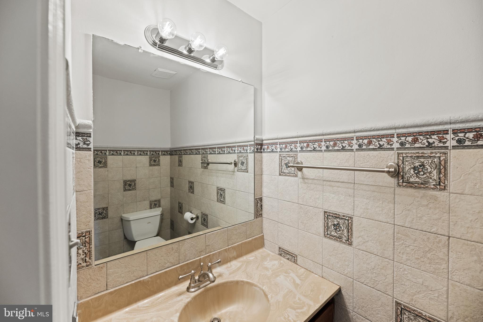 10906 Equestrian Court Reston, VA 20190 - Photo 14 of 36 Powder room on first floor.
