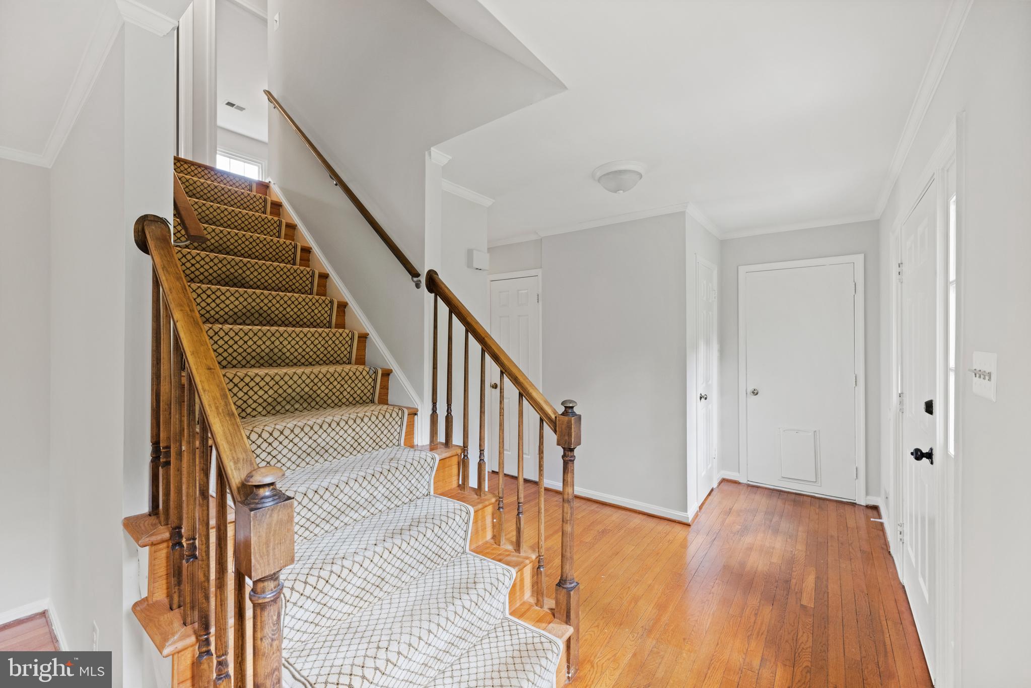 10906 Equestrian Court Reston, VA 20190 - Photo 4 of 36 Front staircase, foyer, and entry to/from garage.