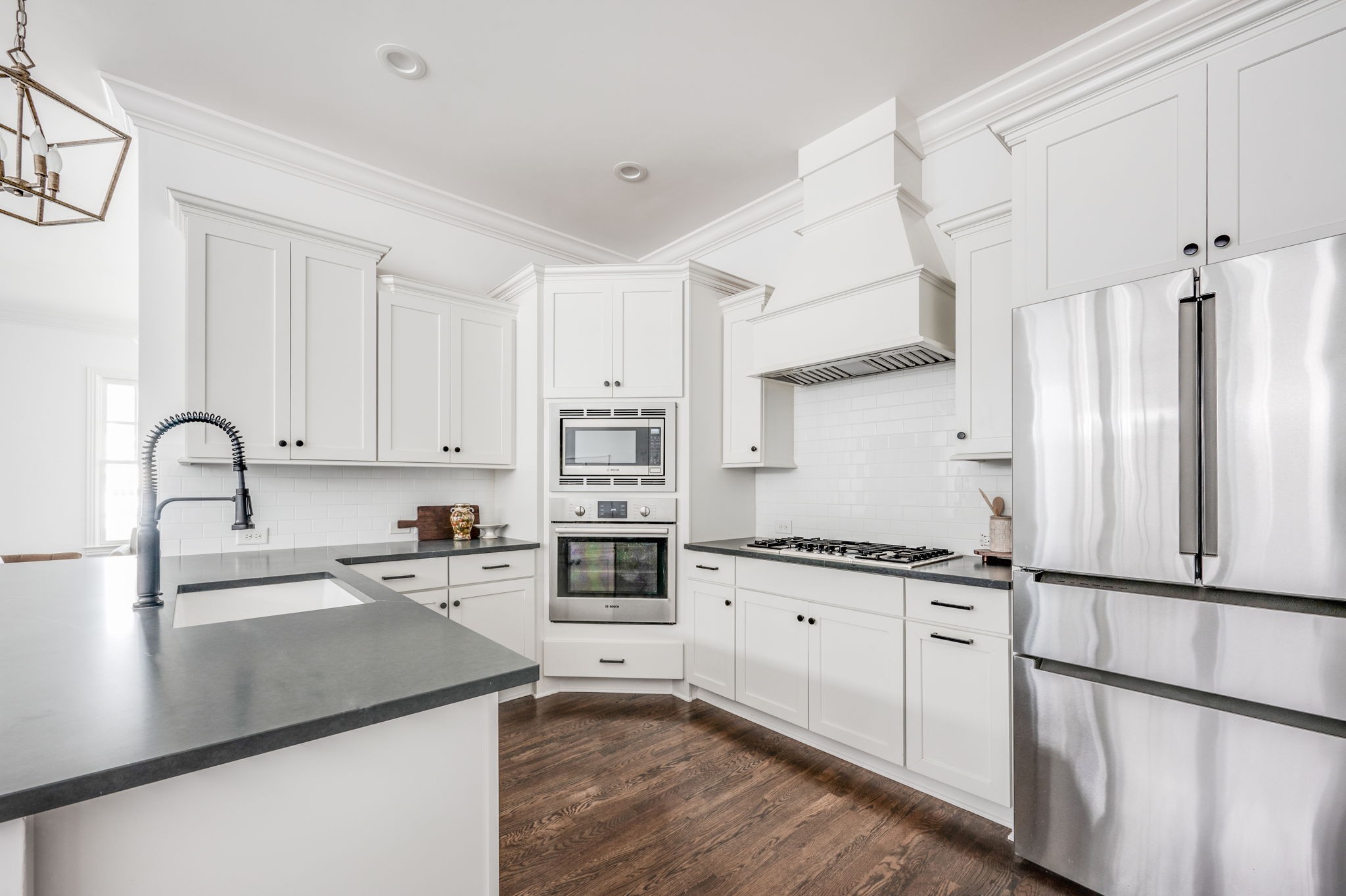 5144 Donovan Street Franklin, TN 37064 - Photo 19 of 52 a kitchen with granite countertop a sink appliances and cabinets