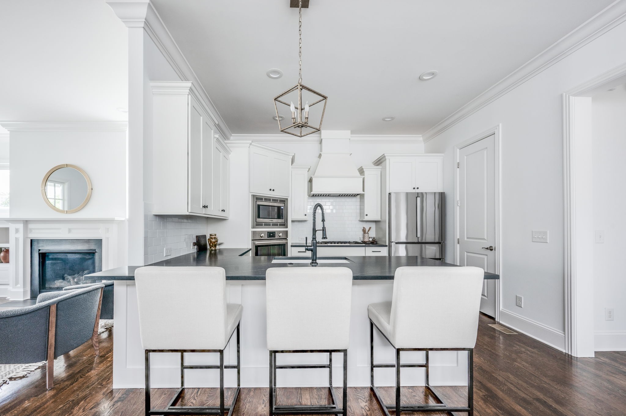 5144 Donovan Street Franklin, TN 37064 - Photo 23 of 52 a kitchen with stainless steel appliances a kitchen island a stove a table and chairs