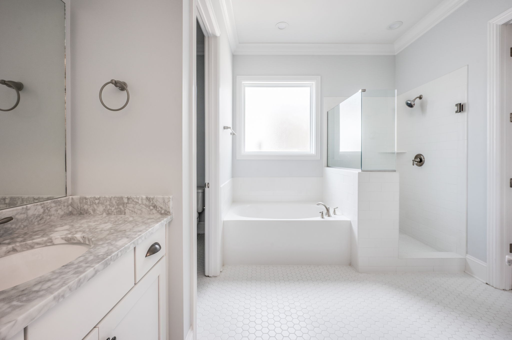 5144 Donovan Street Franklin, TN 37064 - Photo 34 of 52 a bathroom with a granite countertop sink a mirror and a bathtub