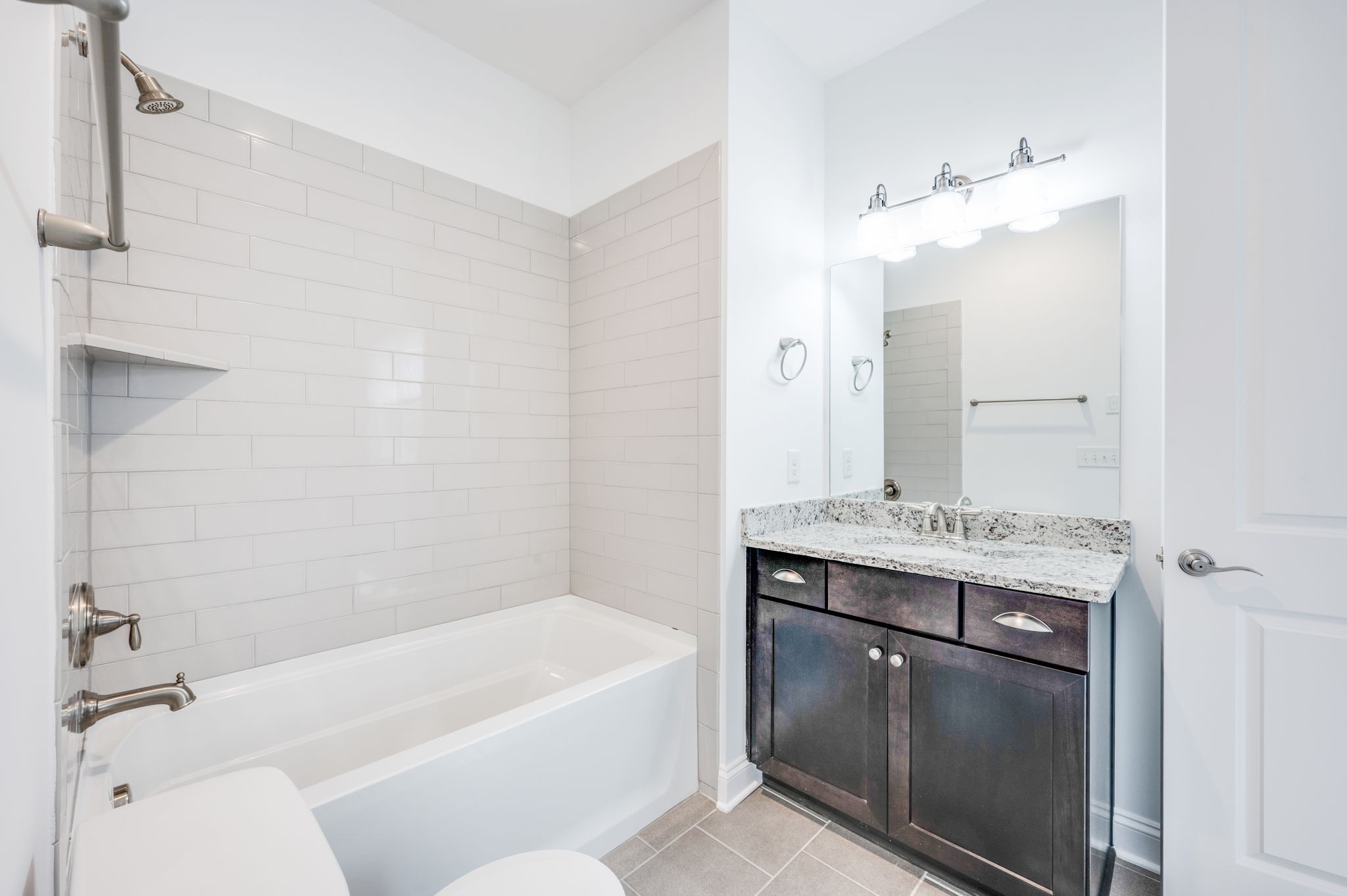 5144 Donovan Street Franklin, TN 37064 - Photo 47 of 52 a bathroom with a tub sink and mirror