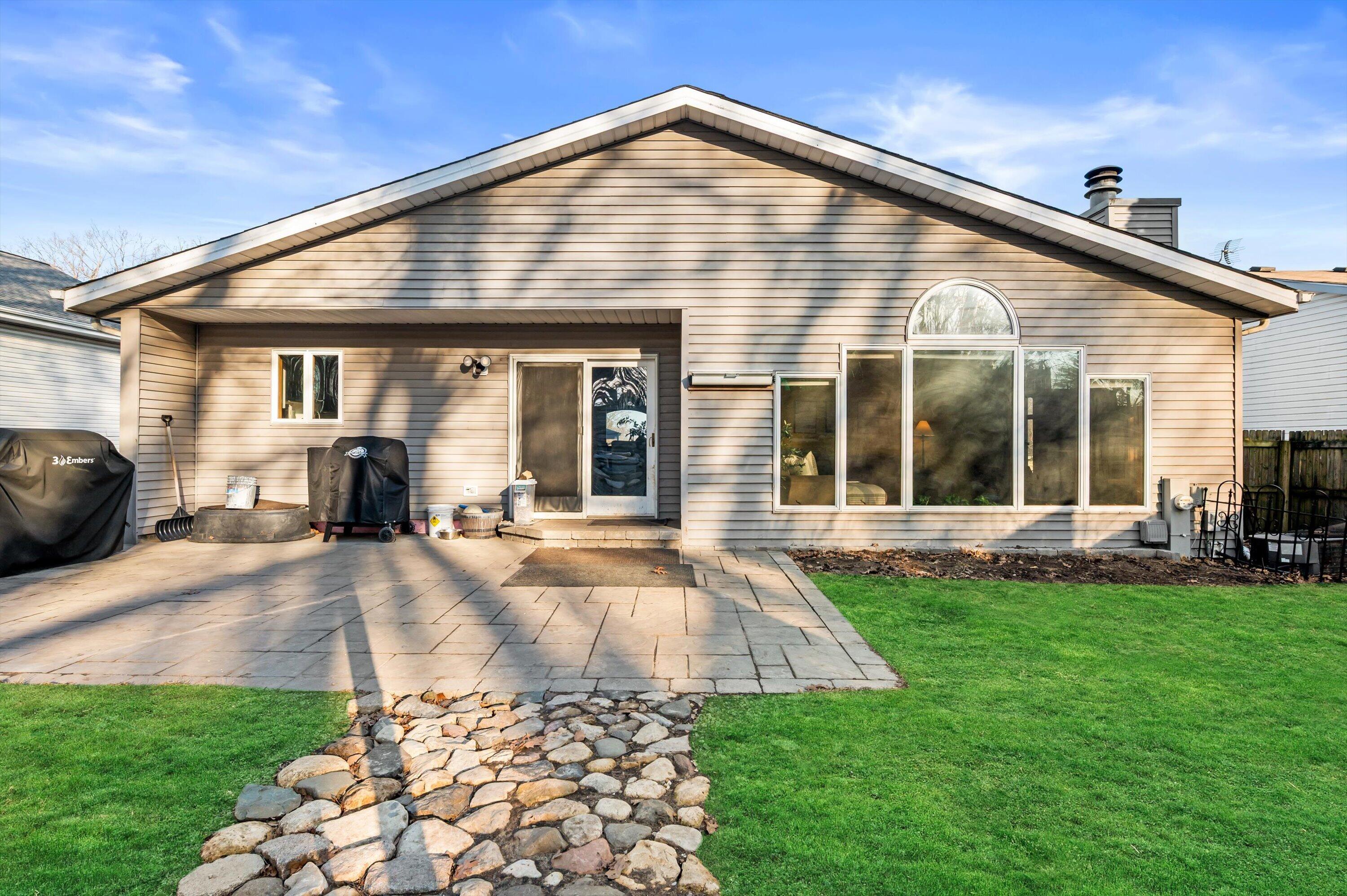 1130 Green Tree Road West Bend, WI 53090 - Photo 33 of 47 Virtual stage green in grass.