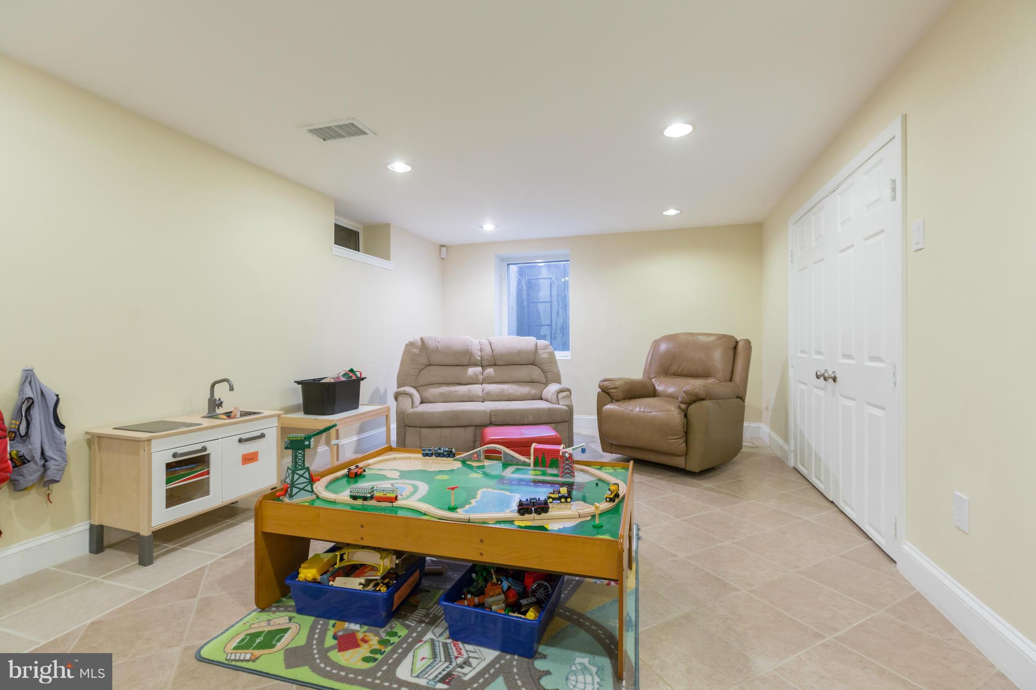 8003 Karl Road Alexandria, VA 22308 - Photo 22 of 30 a living room with furniture and a baby crib