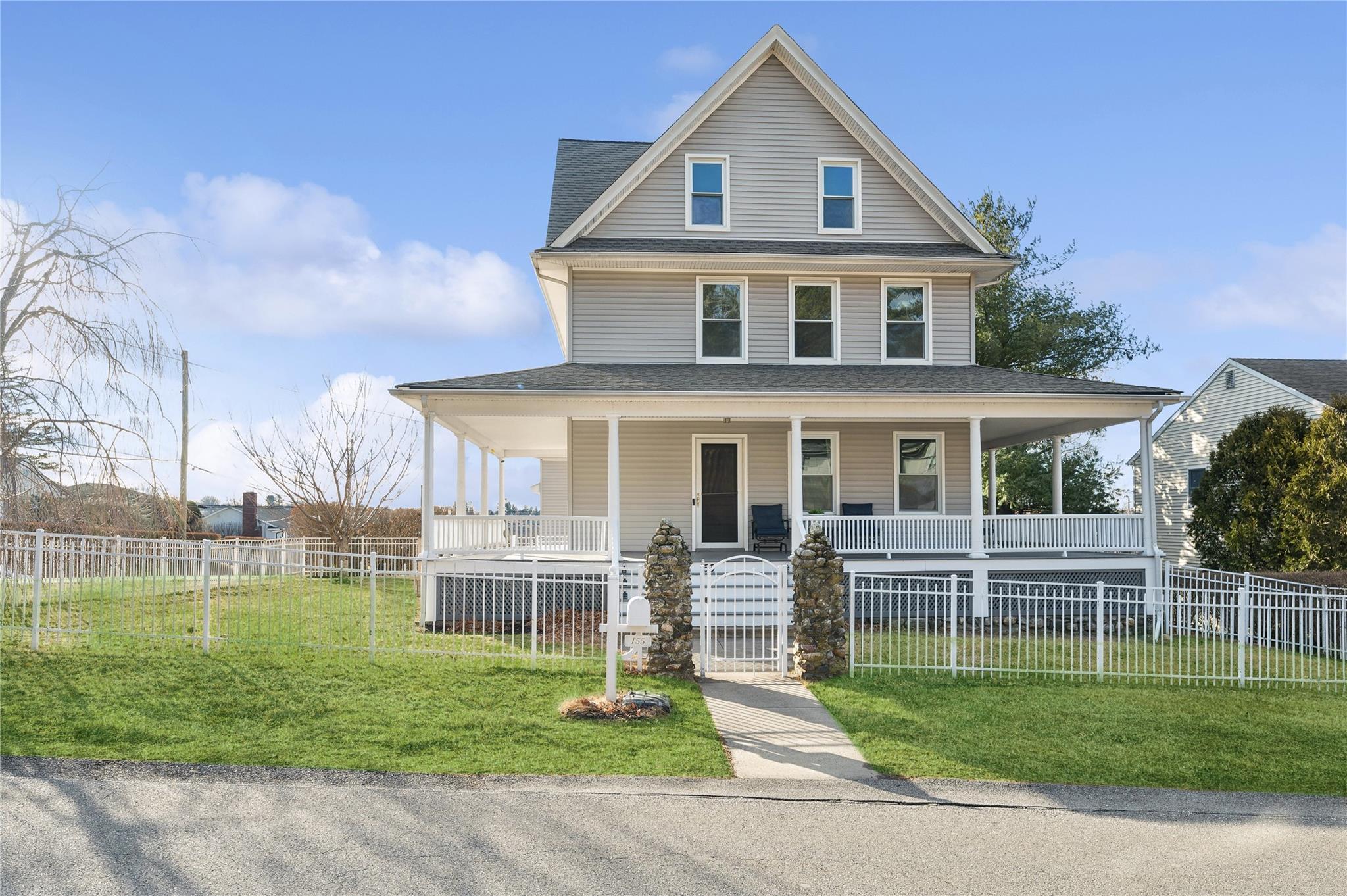 155 Prospect Avenue Valhalla, NY 10595 - Photo 1 of 1 a front view of a house with a yard table and chairs