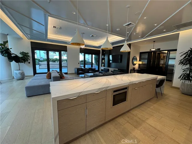 a lobby with gym equipment and large mirror