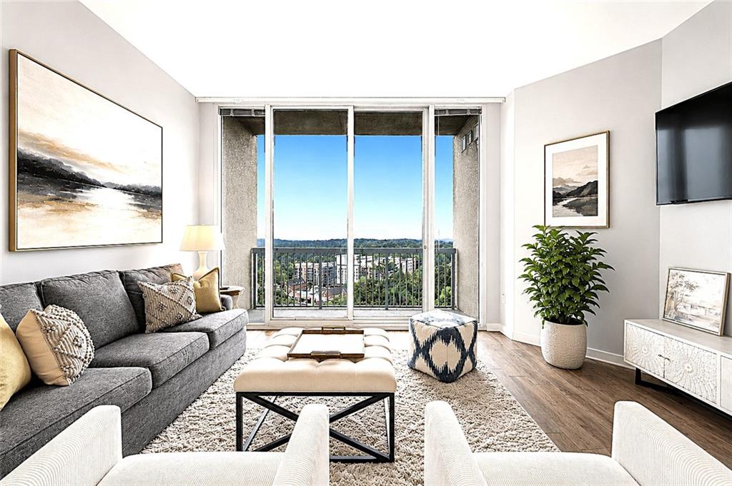 3300 Windy Ridge Parkway Southeast, Unit 1112 Atlanta, GA 30339 - Photo 11 of 43 a living room with furniture and a large window