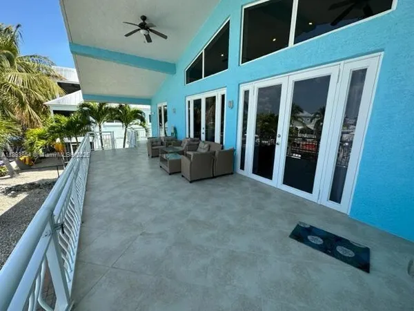 a view of an entryway with a floor to ceiling window