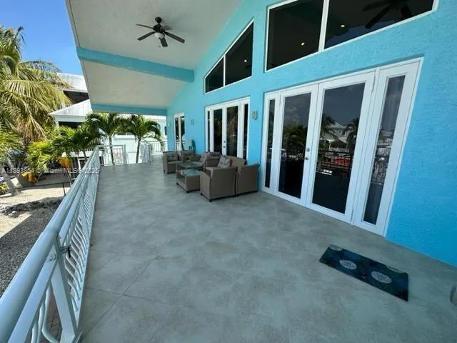 a view of an entryway with a floor to ceiling window