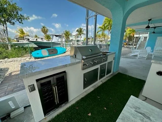 a open kitchen with stainless steel appliances granite countertop a stove a sink and a dishwasher