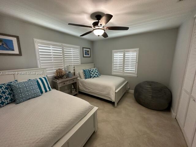 62 Waterways Drive Key Largo, FL 33037 - Photo 4 of 22 a bedroom with a bed and a window