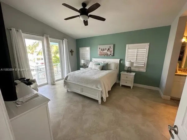 a bedroom with a bed and a couch