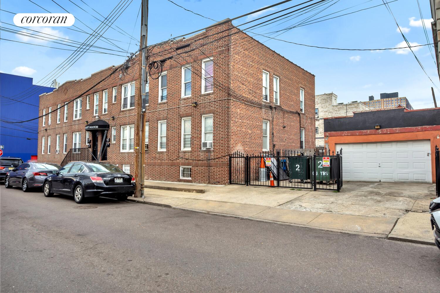 95-07 Cresskill Place Queens, NY 11435 - Photo 7 of 40 a view of a car is parked in front of a building