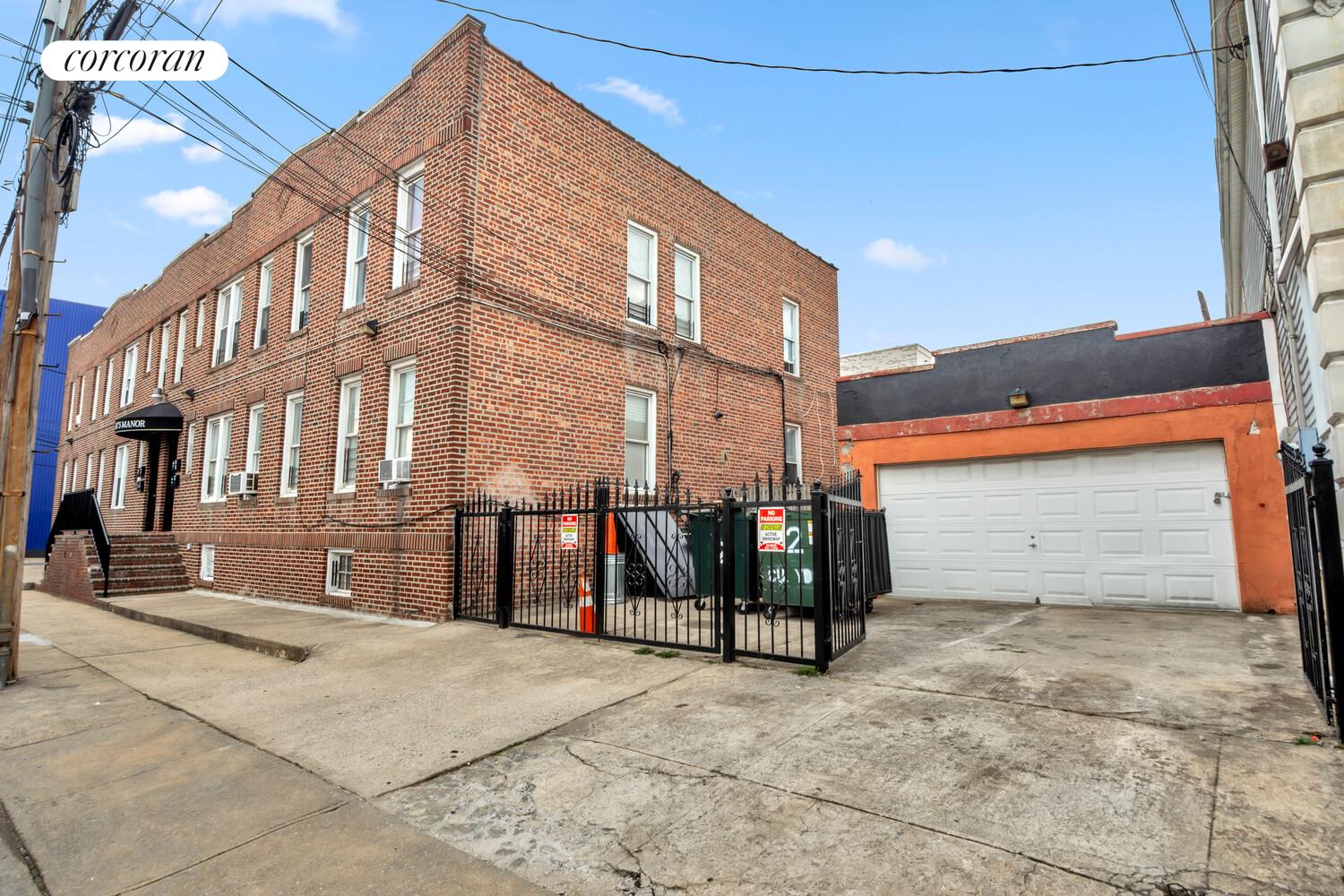 95-07 Cresskill Place Queens, NY 11435 - Photo 9 of 40 a view of a brick building with a bench in front of it