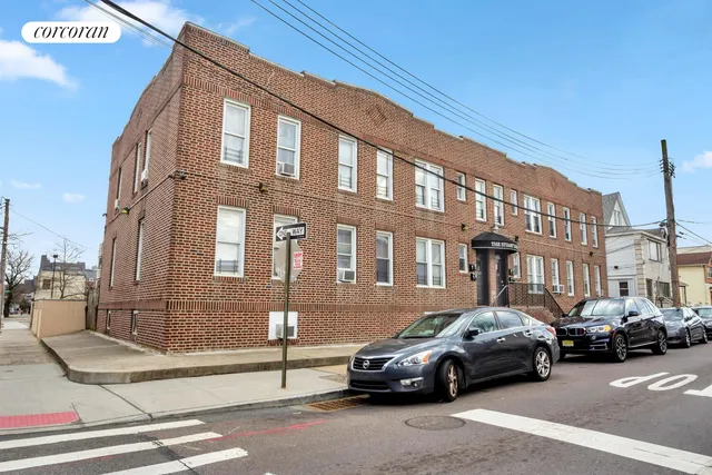 a view of a house with a wooden fence