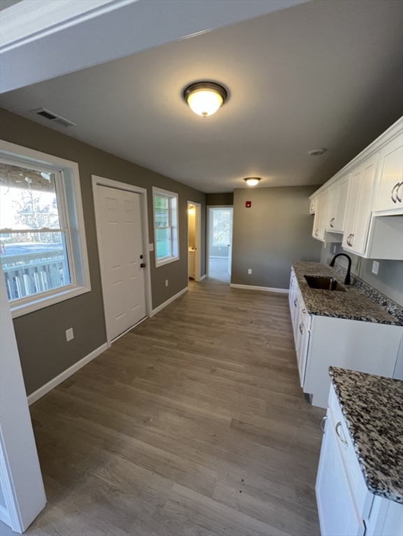 97 Alderman Street Springfield, MA 01108 - Photo 8 of 10 a spacious bathroom with a granite countertop sink a mirror and shower