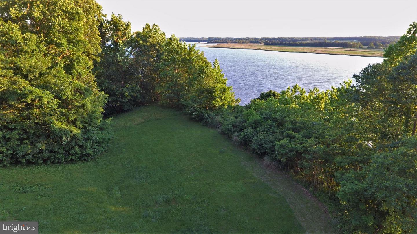 3100 Holland Cliffs Road Huntingtown, MD 20639 - Photo 2 of 44 a view of a lake with outdoor space