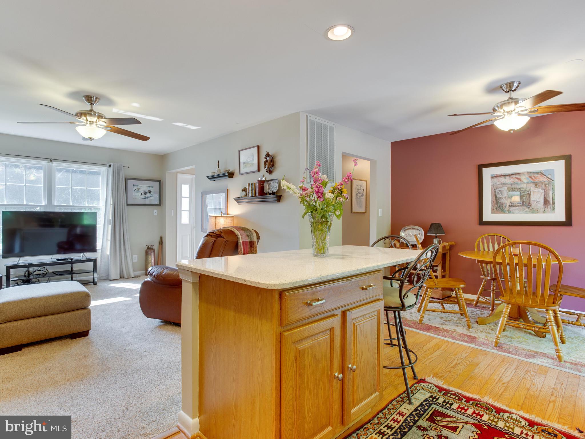 3100 Holland Cliffs Road Huntingtown, MD 20639 - Photo 10 of 44 a view of a livingroom with furniture and a flat screen tv